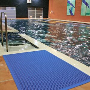 Blue leisure mat beside steps into a swimming pool