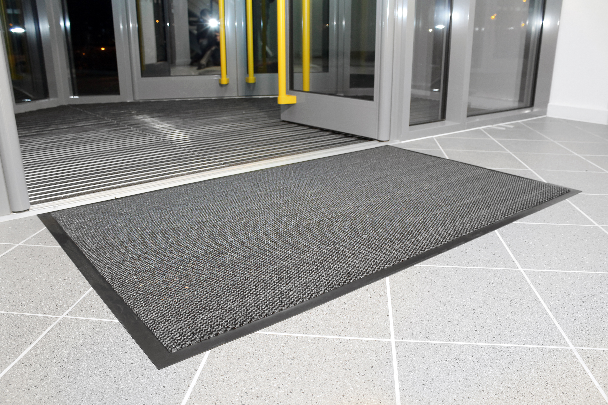 Steel coloured Plush Doormat outside building entrance
